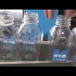 Machine d'étiquetage automatique de bouteilles carrées en plastique à double face